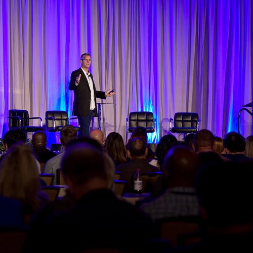 Michael Blank speaking on stage
