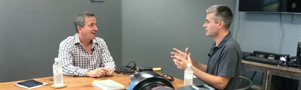 Michael Blank recording the Financial Freedom with Real Estate Investing podcast, camera in frame